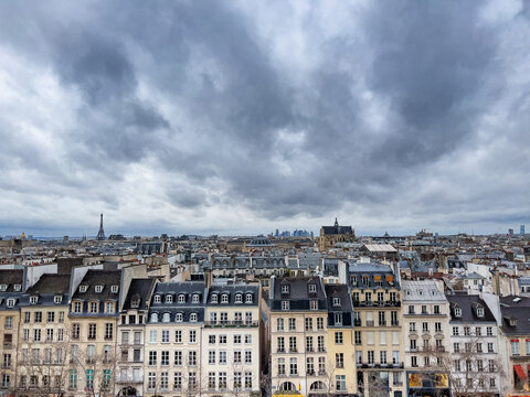 Rows of old Paris Haussmann houses and churches in downtown