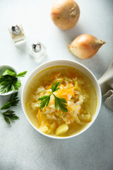 Traditional homemade sauerkraut soup with fresh parsley