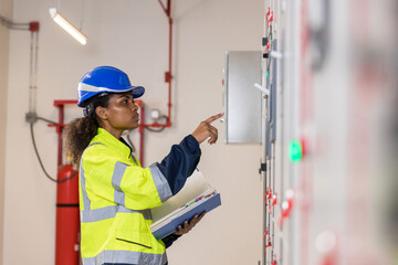 Electrical engineer working in control room.  Electrical engineer man checking Power Distribution...