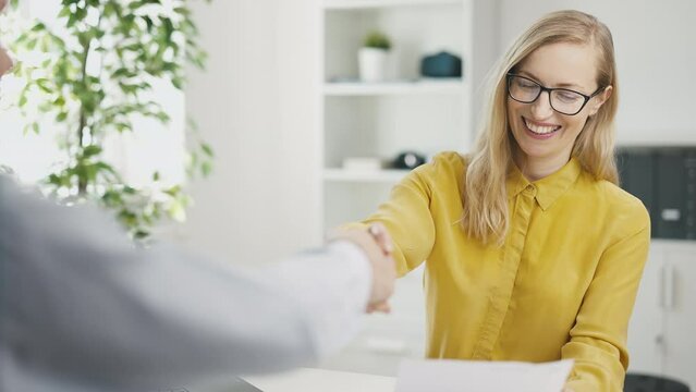 Young man was hired on new job, successful interview in office with boss woman