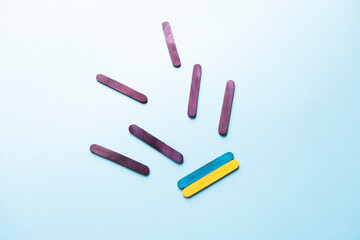 Ukrainian flag on a blue background top view. War in Ukraine. Ukraine attack