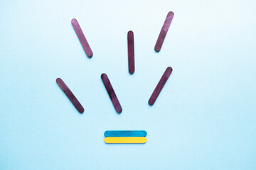 Ukrainian flag on a blue background top view. War in Ukraine. Ukraine attack