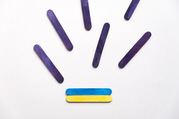 Obraz premium Flag of ukraine on a beige background, flying rockets top view.