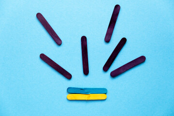 War in Ukraine. political conflict. Rocket attacks on Ukraine. Flag of Ukraine from colored sticks.