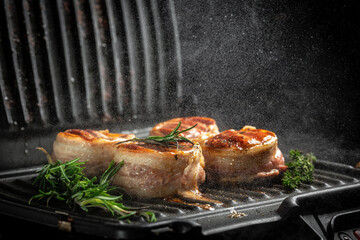 Premium Beef Steak. Grilled meat steak Filet Mignon with seasonings. Juicy meat steak. Beef steak grilled on dark background with spices. Ketogenic diet food