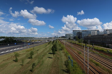 Obraz na płótnie Canvas Railway and highway landscape with sky in Warsaw
