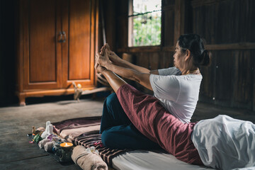 Massage and spa relaxing treatment of office syndrome traditional thai massage style. Asain senior...