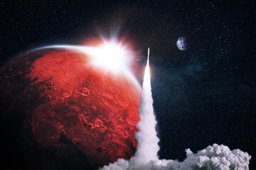 Space rocket successfully takes off into space with the red planet mars with the sunset. Space...
