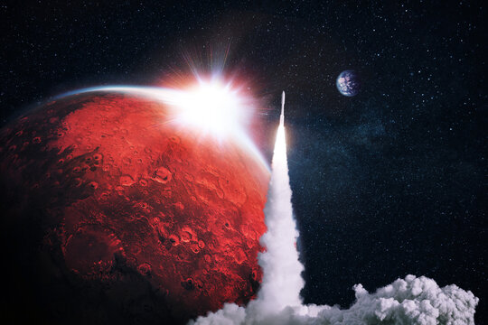 Space rocket successfully takes off into space with the red planet mars with the sunset. Space mission and a spaceship. Concept of space exploration and travel to other planets