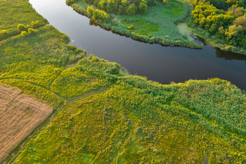 Drone view over summer sunset river Ros landscape, Ukraine.