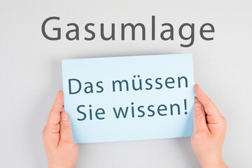 Gas commission is standing in german language on the paper, new fee regualtion in Germany, risk for...