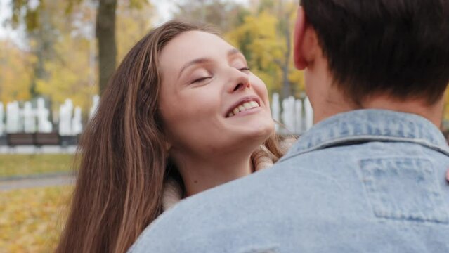 Close up beloved happy wife girlfriend get red gift small present box pleasant surprise for valentine's day birthday thankful woman hugging embrace loving adorable boyfriend kiss husband say thanks