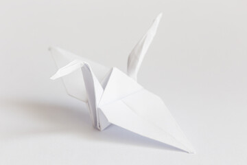 Swan origami on white background