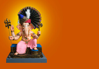 Hindu God Ganesha on colourful bokhe background, Ganesha Idol. Ganesh festival. copy Space.