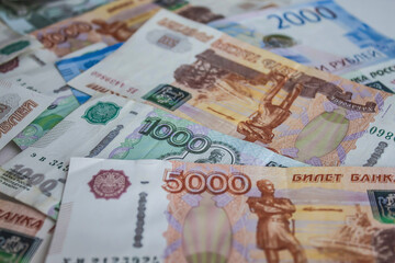 Russian banknotes of different denominations on the plane.