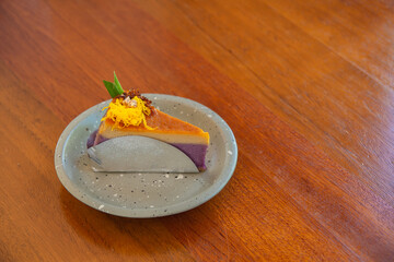 Chiffon cake, Bean custard chiffon cake in purple color on a wooden table.