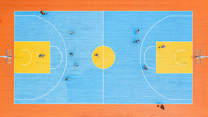 Basketball court, game on. basketball competition among women's teams top view. Aerial top view