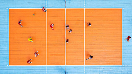 Top view of the volley ball court during game. Aerial view of playing volleyball