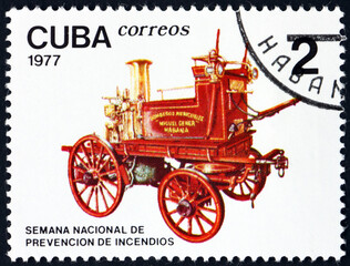 Fototapeta na wymiar Postage stamp Cuba 1977 horse-drawn fire pump
