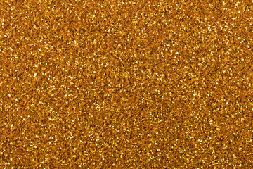 Gold handmade glitter texture background sparkling shiny wrapping paper for Christmas holiday seasonal wallpaper decoration, greeting and winter Cristmas design element.