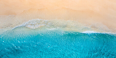 Summer panorama seascape landscape waves, blue sea water sunny day. Top view from drone. Sea aerial view, amazing tropical nature background. Beautiful Mediterranean waves surf splashing panorama