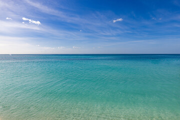 Nature landscape view of beautiful tropical beach sea in sunny day. Summer seascape beautiful waves, blue sea water. amazing tropical nature background. Beautiful bright sea waves splashing and beach