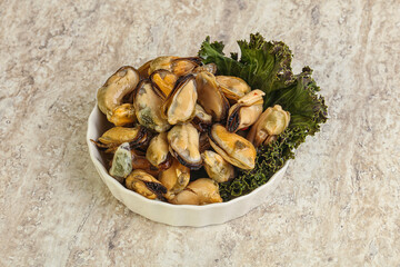 Tasty marinated mussels in the bowl