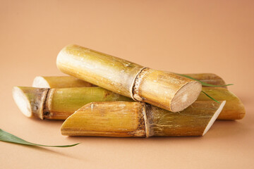 Sugarcane on a brown background, close-up.