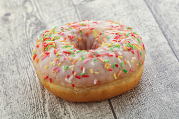 Sweet glazed vanilla donut with icing