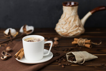 a cup of coffee on wooden table 