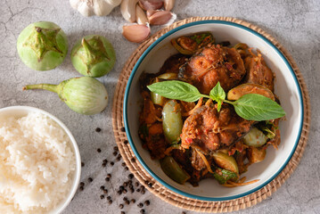 Top view stir fried spicy catfish with red curry paste, served with streamed jasmine rice as traditional food Thailand