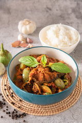 Stir fry spicy catfish with red curry paste, served with streamed jasmine rice as traditional food Thailand