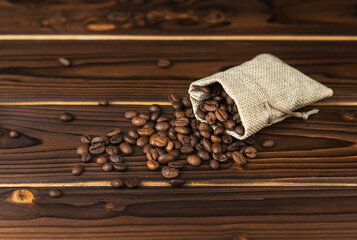 coffee beans from linen bag  on wooden table
