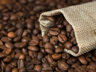 coffee beans from linen bag  on wooden table