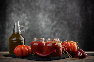 Fototapeta na wymiar Tomato sauce in a glass jar