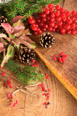 branches of holly, pine cones, mountain ash berries