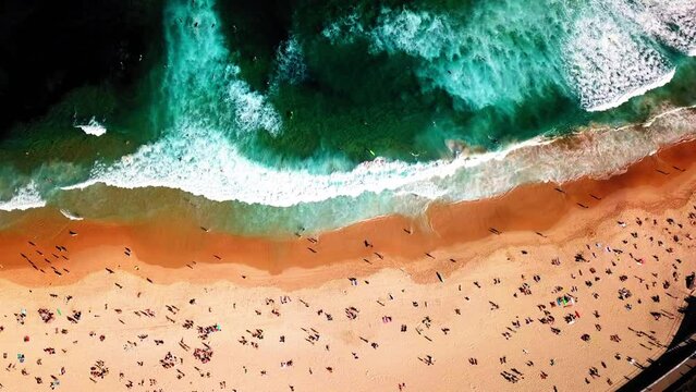Aerial Top Upward Shot Of Tourists With Surfboards At Beach, Drone Flying Upwards On Sunny Day - New South Wales, Australia