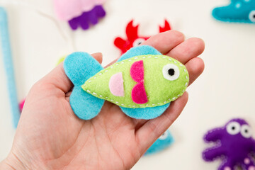 Hand made stuffed felt toy. Fishing rod with magnet and fishes or other sea animals. Different colors. Safe eco stuffed toy for infants and toddlers. Early education implement.
