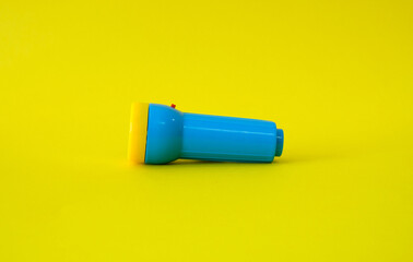 Flashlight on a bright yellow background