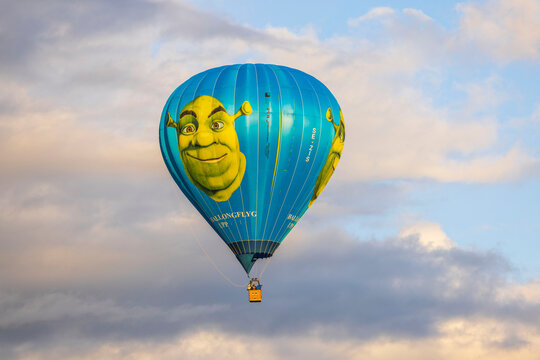 View of Shrek hot air balloon in cloudy blue sky. Sweden.