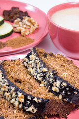 Homemade zucchini dough and cup of white coffee. Delicious dessert. White background