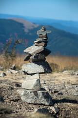 Closeup of stone balance at the top of the mountain