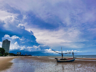 Fishing boat on the beach of Hua Hin, Thailand.  Beautifull sky.