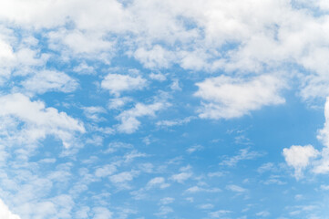 Beautiful white fluffy clouds in blue sky. Nature background from white clouds in sunny day