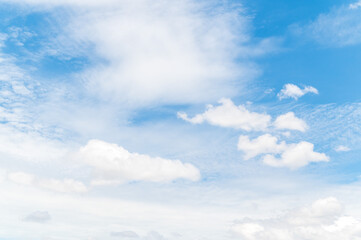Beautiful white fluffy clouds in blue sky. Nature background from white clouds in sunny day