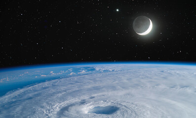 Giant hurricane seen from the space with crescent"Elements of this image furnished by NASA"
