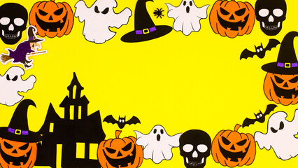 Creative Halloween frame made of various scary stickers on yellow background. Copy space flat lay
