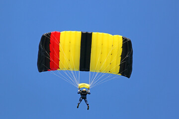 Skydiver flying wing in a blue sky	