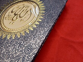 Yassin's book appears with a black batik patterned cover on a red background