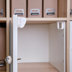 Magnetic child-proof lock for locking cabinet doors and drawers of home furniture